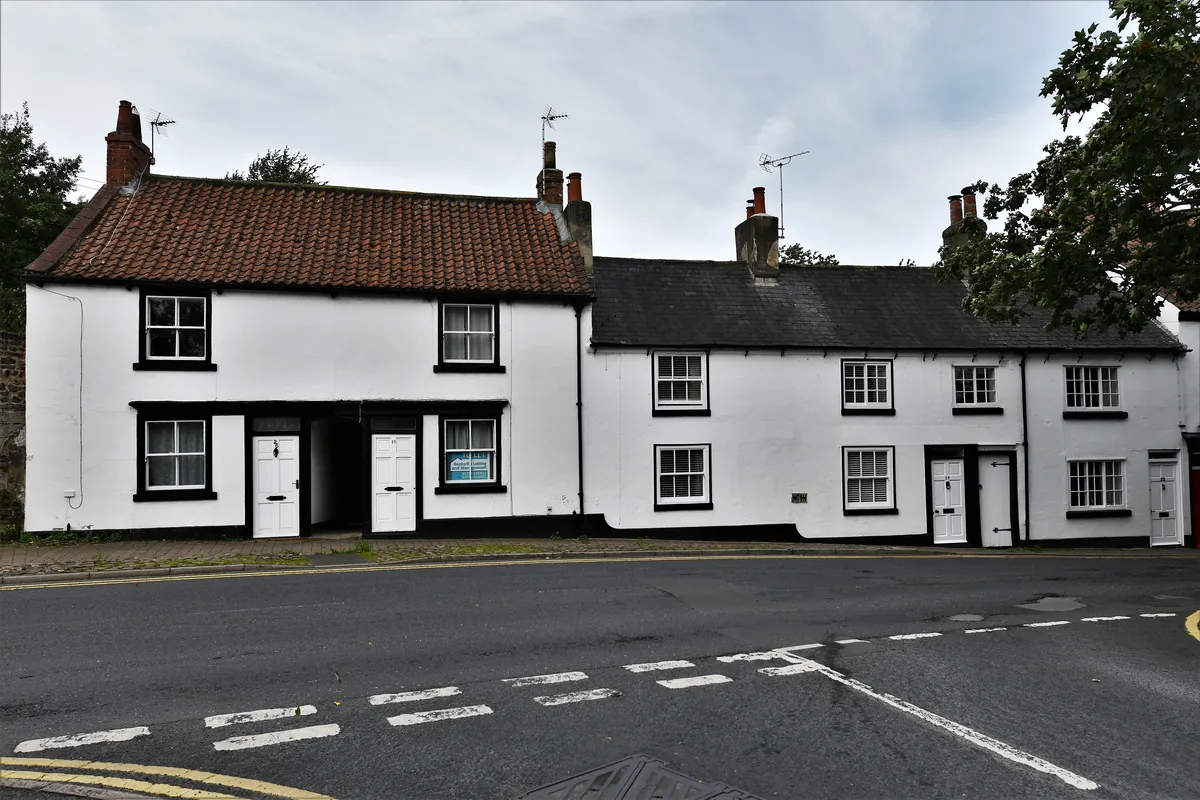 A row of white-painted cottages on St Marygate in Ripon