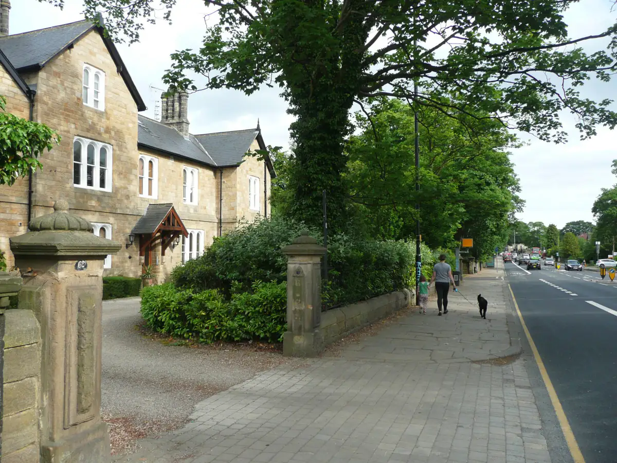 A stone house behind a gateway on Otley Road in Headingley, Leeds